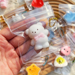 Tylices squishy en funda con cadena para llevar y colgar fácilmente