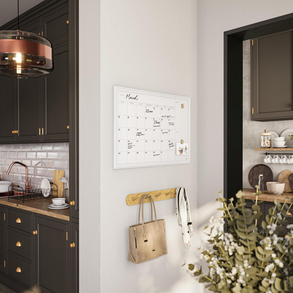 U Brands magnets holding notes and pictures showing magnetic board versatility and quick reminders