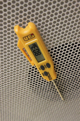 UEi PDT650 mounted on metal duct demonstrating hands-free reading benefit