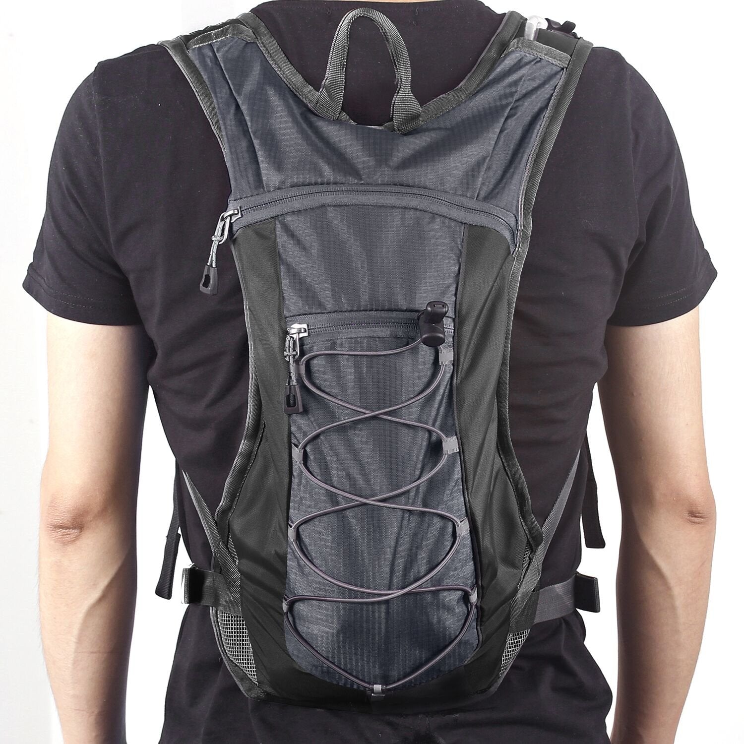 Unigear next to water bottle showing pack size and 2L bladder capacity