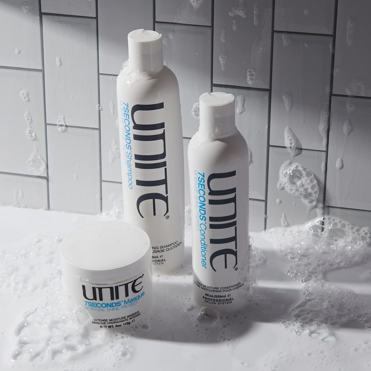 UNITE envase junto a referencia de escala destacando su formato 8 fl oz