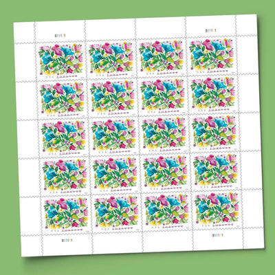 United States Postal Service sheet held in hand to show scale of Celebration Blooms stamps for planning
