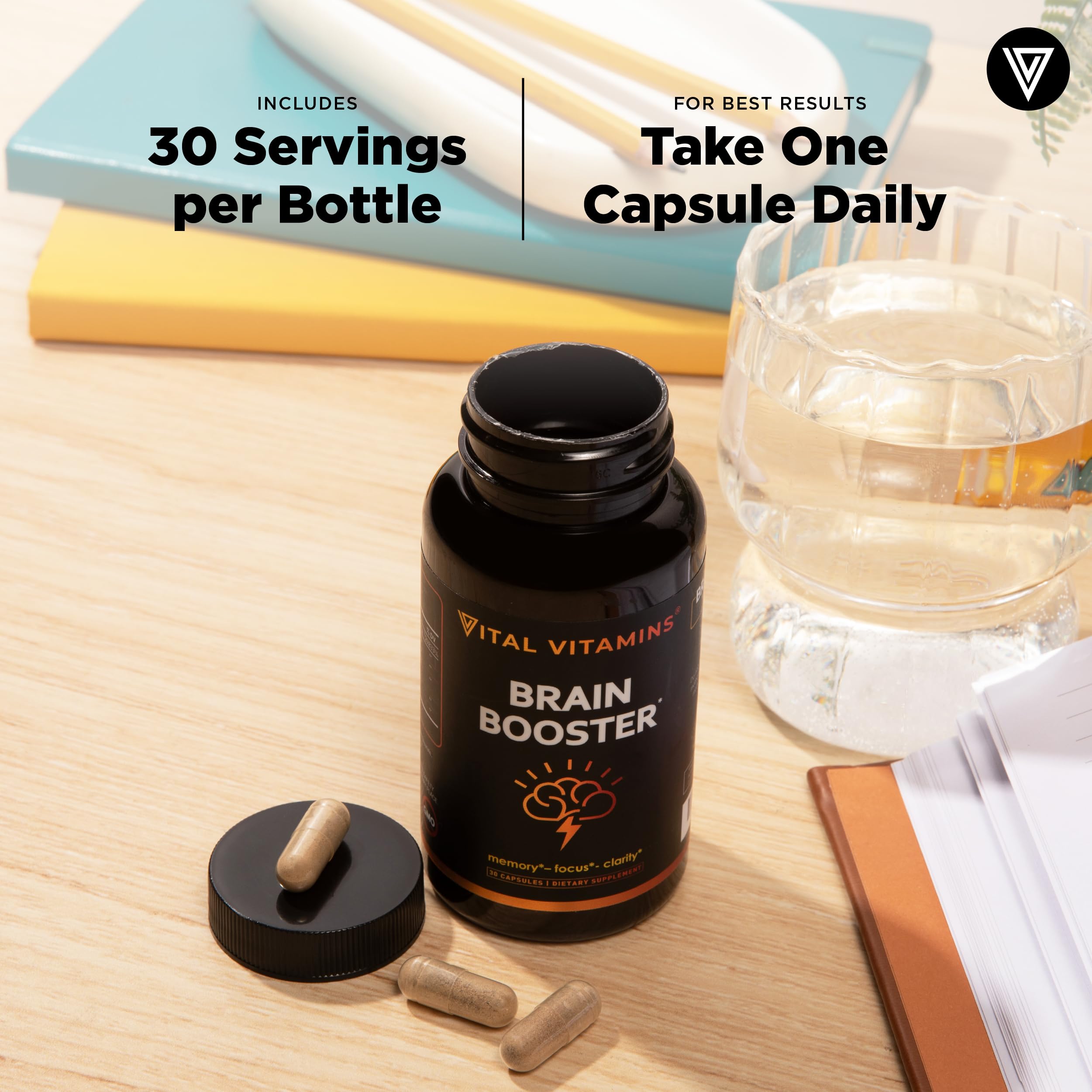 Vital Vitamins on a desk in use to suggest focus support during work or study