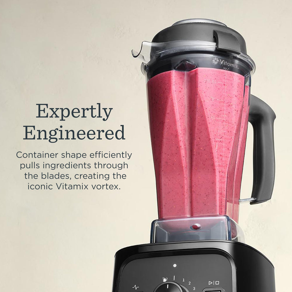 Vitamix VX1 blending a vibrant smoothie in container showing smooth, consistent results
