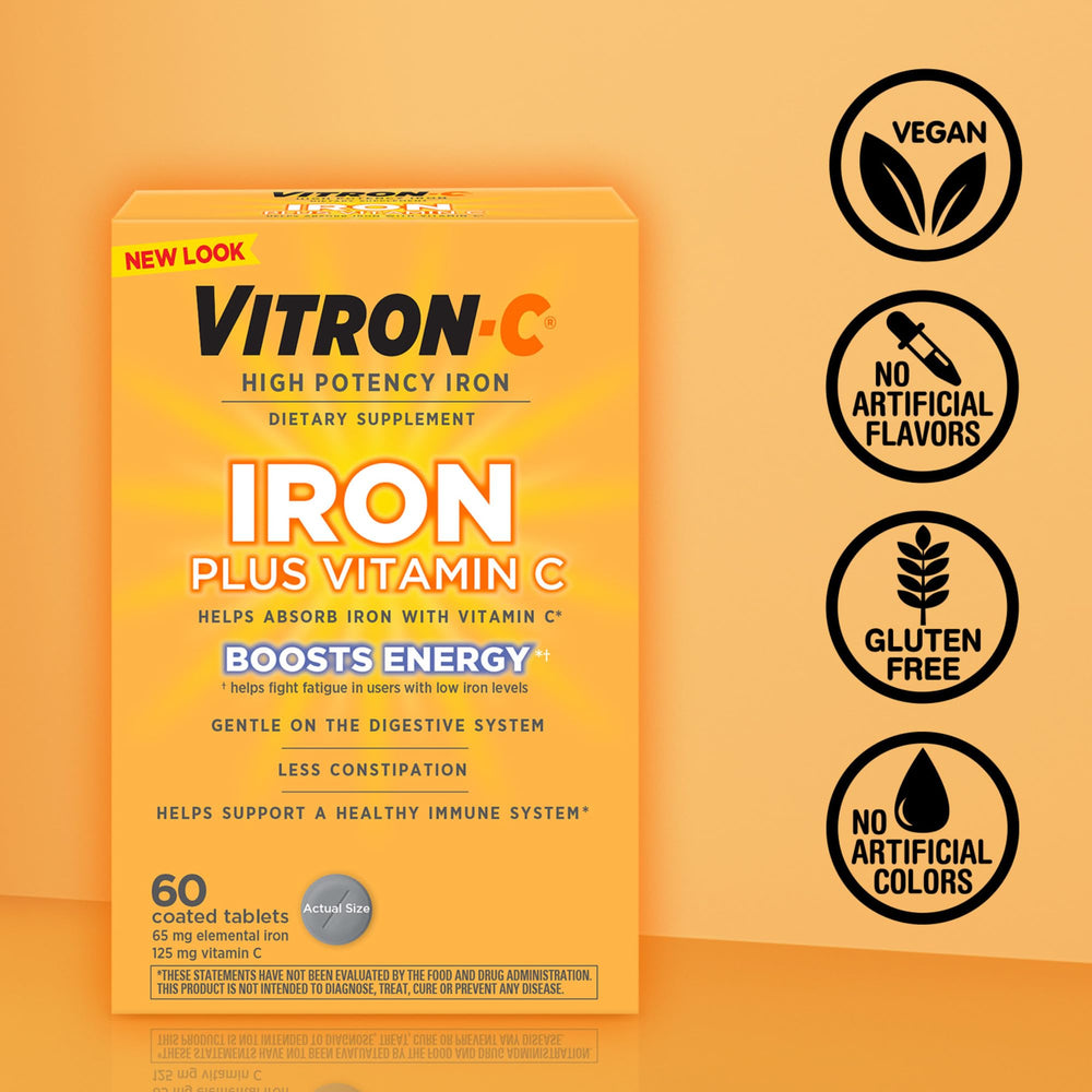 Vitron-C comprimido junto a vaso de agua en rutina matutina para energía