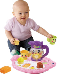VTech niño jugando con la bandeja iluminada que fomenta compartir