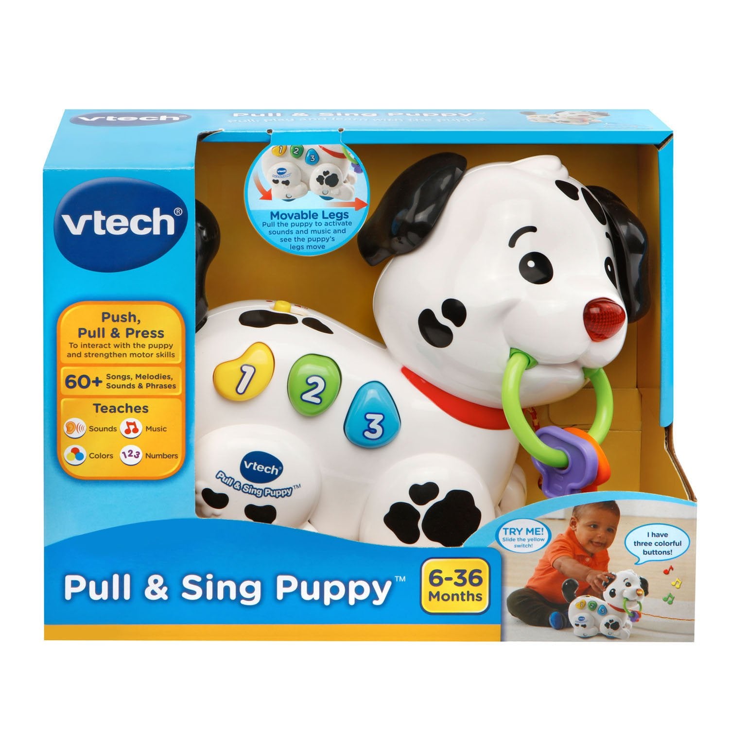VTech perrito junto a una taza para escala, muestra tamaño portátil