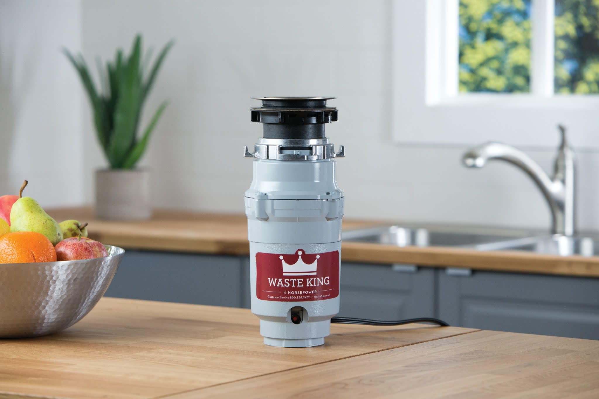 Waste King detalle de impulsadores de acero inoxidable para menos atascos