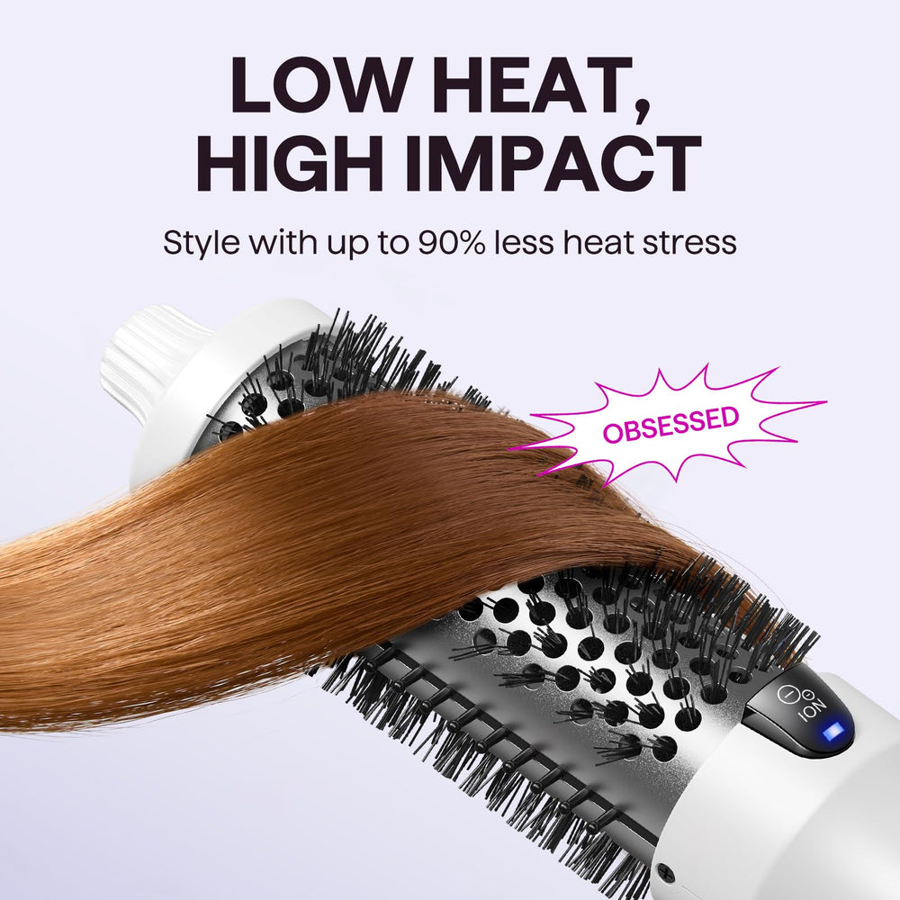 wavytalk brush next to hand showing 1.5-inch barrel size and ease