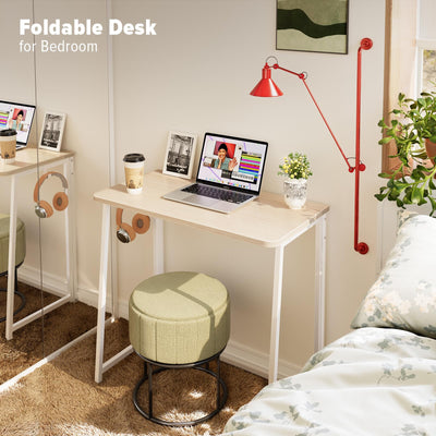 WOHOMO desk stored behind a door illustrating space-saving convenience