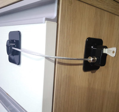YEYA lock held next to adult hand to show compact size and scale advantage