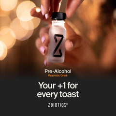 ZBiotics bottle beside a drinking glass illustrating pre-drink use benefit