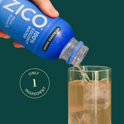 ZICO bottle in hand demonstrating portable single-serve convenience