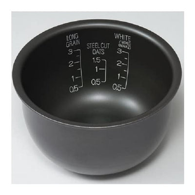 Zojirushi cooked rice plated in kitchen lifestyle scene illustrating consistent fluffy results