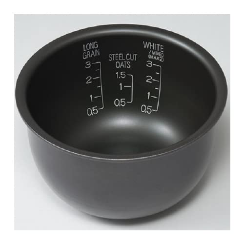 Zojirushi cooked rice plated in kitchen lifestyle scene illustrating consistent fluffy results